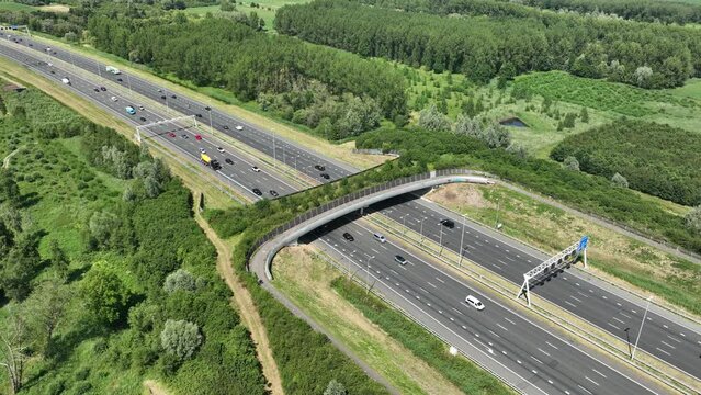 Aerial video of highway with a ecoduct to allow for safe passage of wildlife near Utrecht, The Netherlands.