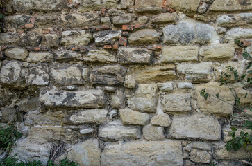 Stone wall, cracked plaster, cracks, ruin, break walls for mock up. Rustic old surface. Empty background