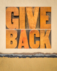 give back inspirational word abstract in vintage letterpress wood type on art paper, give back to society or community concept