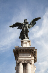 Architectural detail of Baroque bronze statue in Italy, Rome.