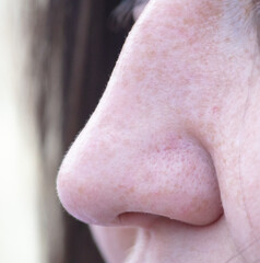 Close-up of a girl's nose. Macro
