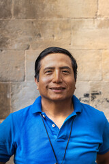 Fototapeta premium Street portrait of a smiling Peruvian man in the city of Barcelona (Spain).
