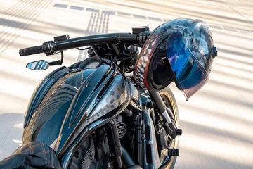 Foto auf Acrylglas Motorrad Cool motorbike with helmet on handle of motorcycle the city