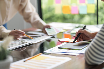 Startup creative designer women planing a project ideas with color palette..