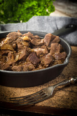 Beef stew in a cast iron skillet.
