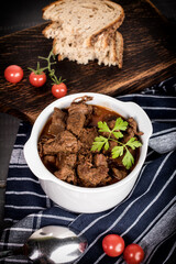 Beef meat stew in ceramic pot.
