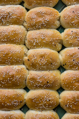 Homemade pies sprinkled with sesame seeds. Appetizing homemade cakes