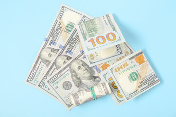 One hundred dollar banknotes on color background