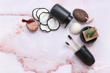 Set of cosmetic products and bath accessories on light background
