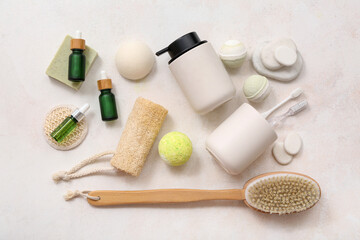 Composition with different bath accessories and cosmetics on light background