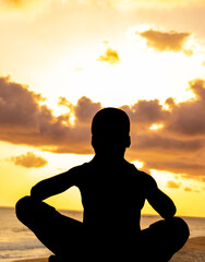 A breathtaking image of a young boy finding harmony and connection with nature, his silhouette...