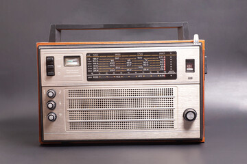 Old transistor radio. English translation: setting indicator, network, ranges, landmark scale, 8 bands,dv, sv, 5 kv, vhf (inscription in Russian).