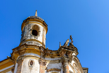 Tower and facade of a historic baroque church in the city of Ouro Preto in Minas Gerais