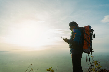 Awe-Inspiring Views: Hispanic Male Witnessing the Majestic Sunrise during a Mountain Hike