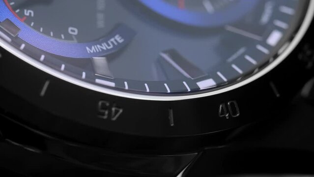 Close Up Of Stylish Luxury Man Wrist Watch With Moving Hand And Multiple Dials. Men's Swiss chronograph watch in metal with sapphire crystal. closeup view of rotating watch , running second arrow