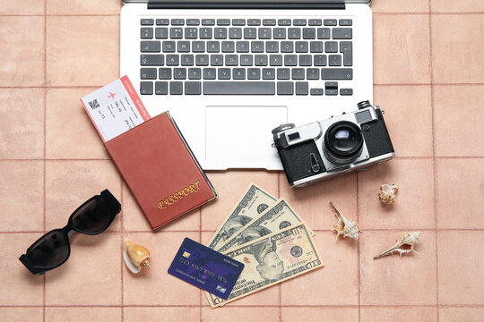 Composition with credit card, money, laptop and photo camera on color tile background