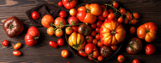 Banner. Tomatoes on a wooden table.
