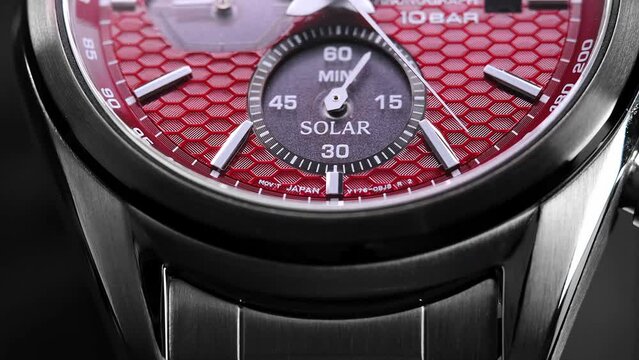 Close Up Of Stylish Luxury Man Wrist Watch With Moving Hand And Multiple Dials. Men's Swiss chronograph watch in metal with sapphire crystal. closeup view of rotating watch , running second arrow