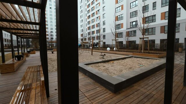 Wooden courtyard. Stock footage. Beautiful large house with a Playground in the yard.