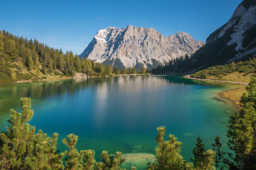Fototapeta na wymiar clear blue alpine lake Seebensee and Zugspitze mountain, austria