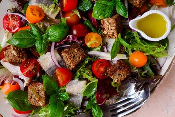 Herring and vegetables summer salad .top veiw.selective focus