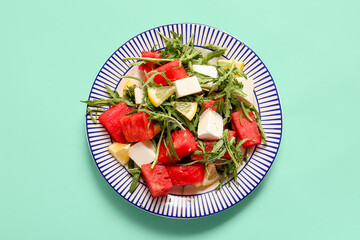 Plates of tasty watermelon salad on turquoise background - Powered by Adobe