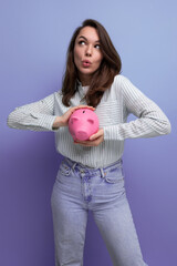 European slender 25 year old young brown-haired woman saved up money for a dream