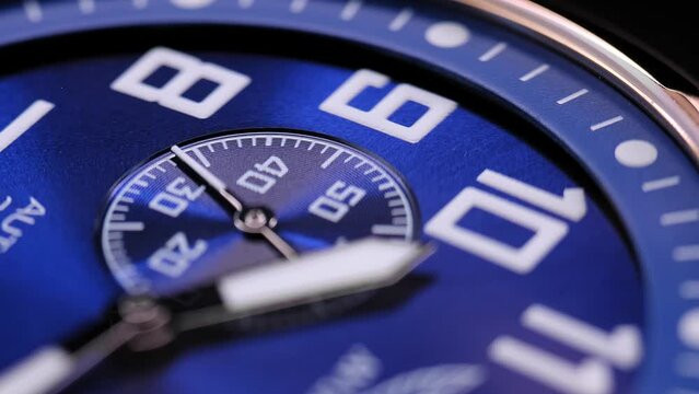 Close Up Of Stylish Luxury Man Wrist Watch With Moving Hand And Multiple Dials. Men's Swiss chronograph watch in metal with sapphire crystal. closeup view of rotating watch , running second arrow