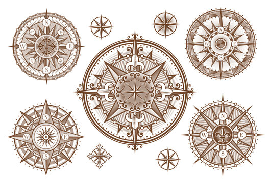 Vintage medieval antique wind rose compass engravings with sun and stars. Vector ancient compass woodcuts with ornate arrows of North, East, West, South directions, victorian fleur-de-lis and scrolls