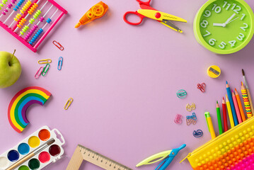 Explore the wonders of early education with this top-down perspective: a captivating arrangement of child stationery on pastel purple backdrop, offering copyspace for text or advertising content