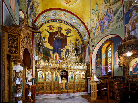 NAZARETH, ISRAEL - JUNE 22,2023:Interior with Iconostasis of the Greek orthodox Church of St George, the wedding church in Kfar Cana Israel. This church is built in the late 19th century