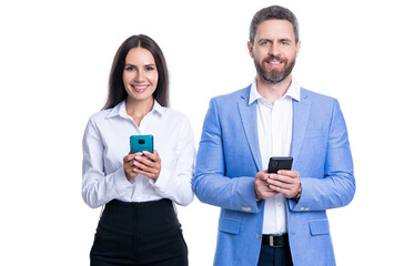 happy businesspeople messaging in studio. couple of businesspeople messaging in formalwear.