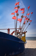 Fishing trawler in the sea on a background of blue sky © jarizPJ