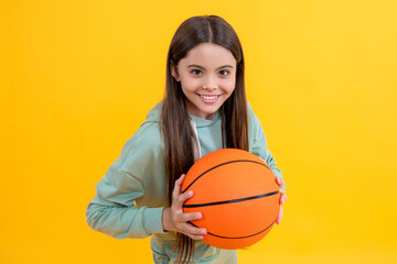 teen girl childhood with basketball. teen girl play with ball. basketball in childhood. Learning skills of basketball at teen girl childhood. Childhood memories of playing basketball. Adrenaline rush