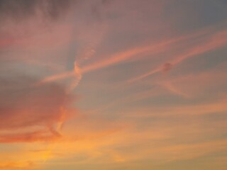 The sunset sky is decorated with clouds in various shapes, very beautiful.