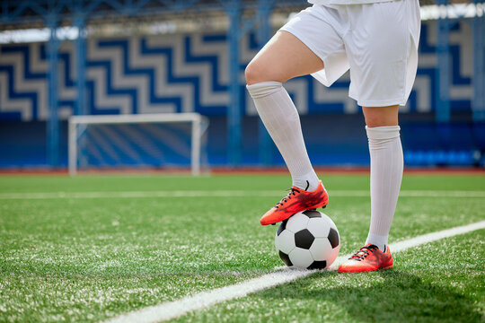 sports girl football player with a soccer ball on the soccer field, the concept of professional women's football