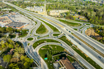 A drone view of a group of roundabouts and a highway
