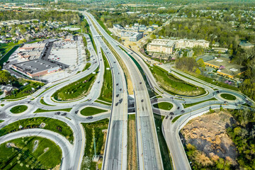 A drone view of a group of roundabouts and a highway - obrazy, fototapety, plakaty