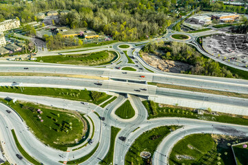 A drone view of a group of roundabouts and a highway