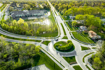 A drone view of a group of roundabouts and a highway