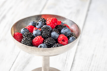 Fresh berries in silver vase
