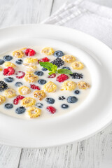 Cereal with milk and berries