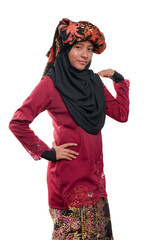 A young malay teenager girl wearing a traditional Negeri Sembilan costume isolated on white background