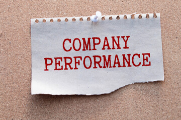 text Company Performance on notebook with pen on a chart background