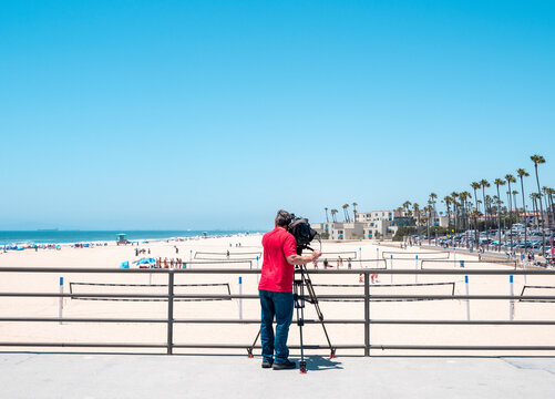 Cameraman on huntington beach pier