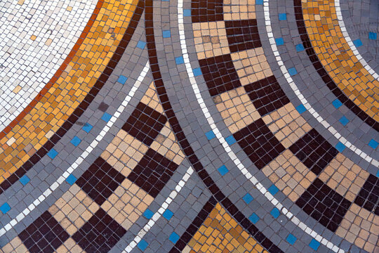 Detail from a mosaic pavement with a circular design in Paris