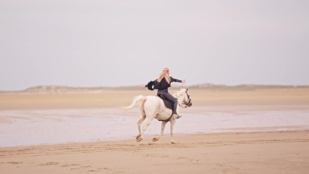 Girl On A Horse With Arms Wide Open