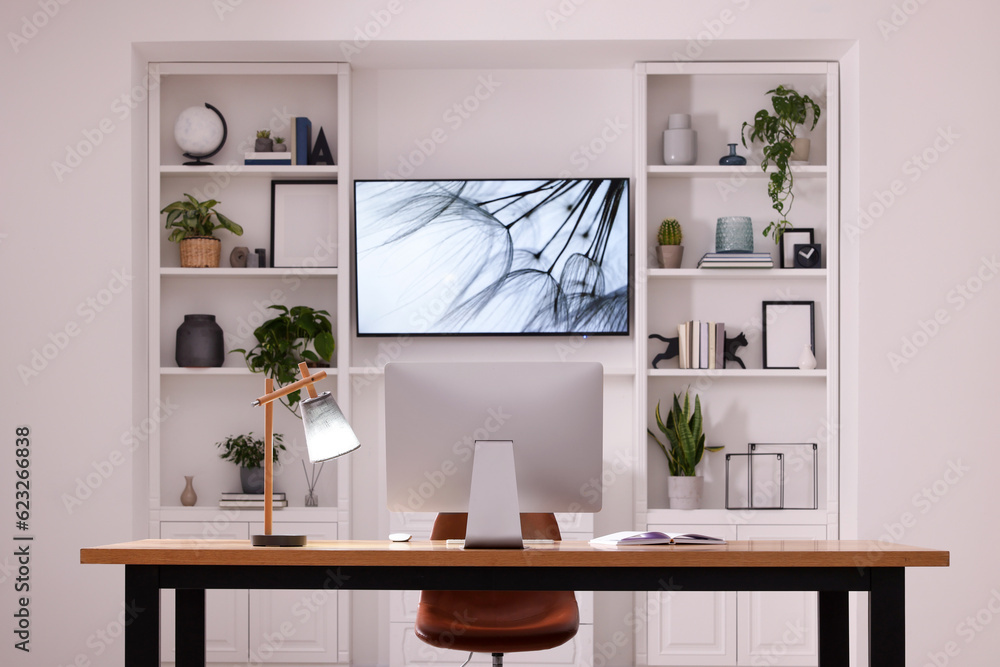 Canvas Prints Cosy workplace with computer near tv area. Interior design