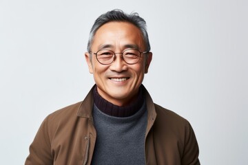 Fototapeta premium Portrait of happy asian senior man in casual clothes and eyeglasses