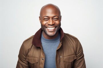 Cheerful african american man smiling at camera on white background